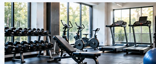 Empty fitness facility with treadmills, stationary bicycles and weights.